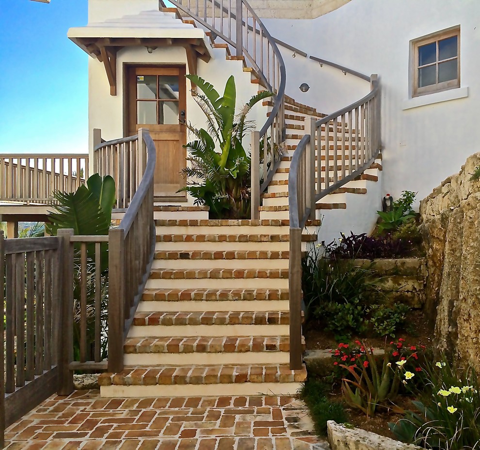 Inspiration for a mid-sized mediterranean front door in Other with a single front door and a dark wood front door.