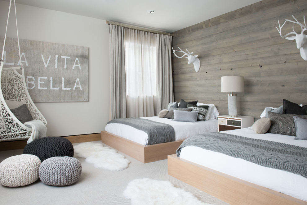 This is an example of a large scandinavian guest bedroom in Denver with white walls, carpet, no fireplace and grey floor.