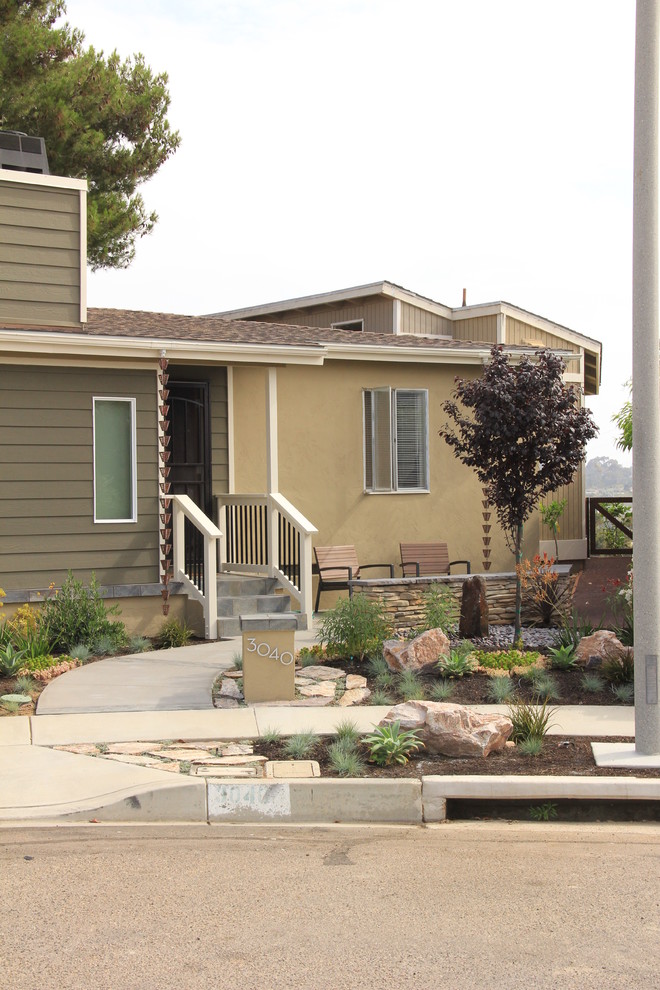 Design ideas for a mid-sized modern one-storey beige exterior in San Diego with mixed siding.