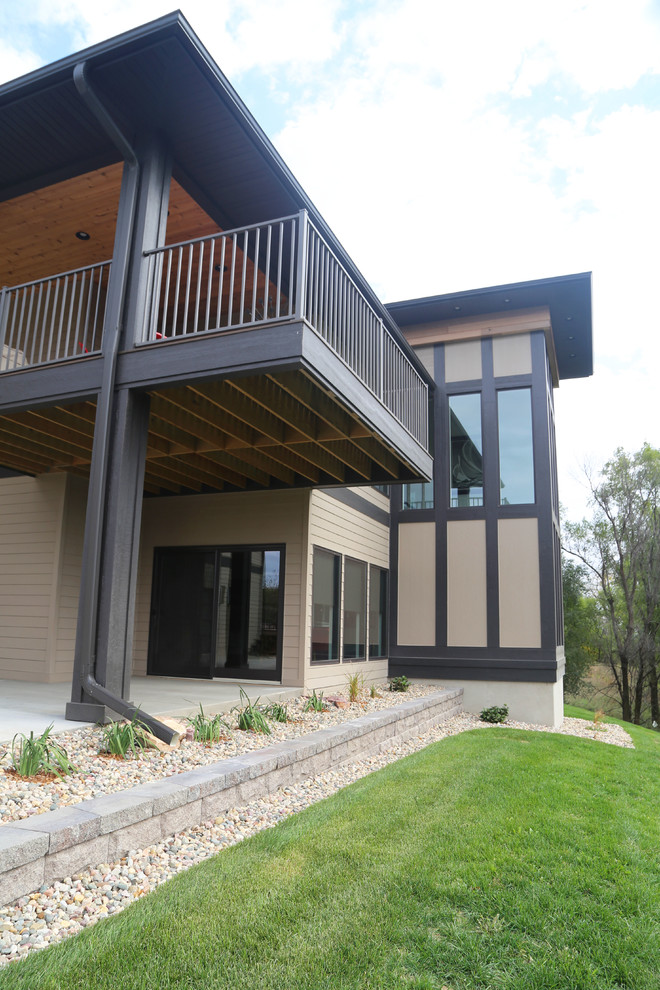 Home design - large transitional backyard home design idea with a roof extension