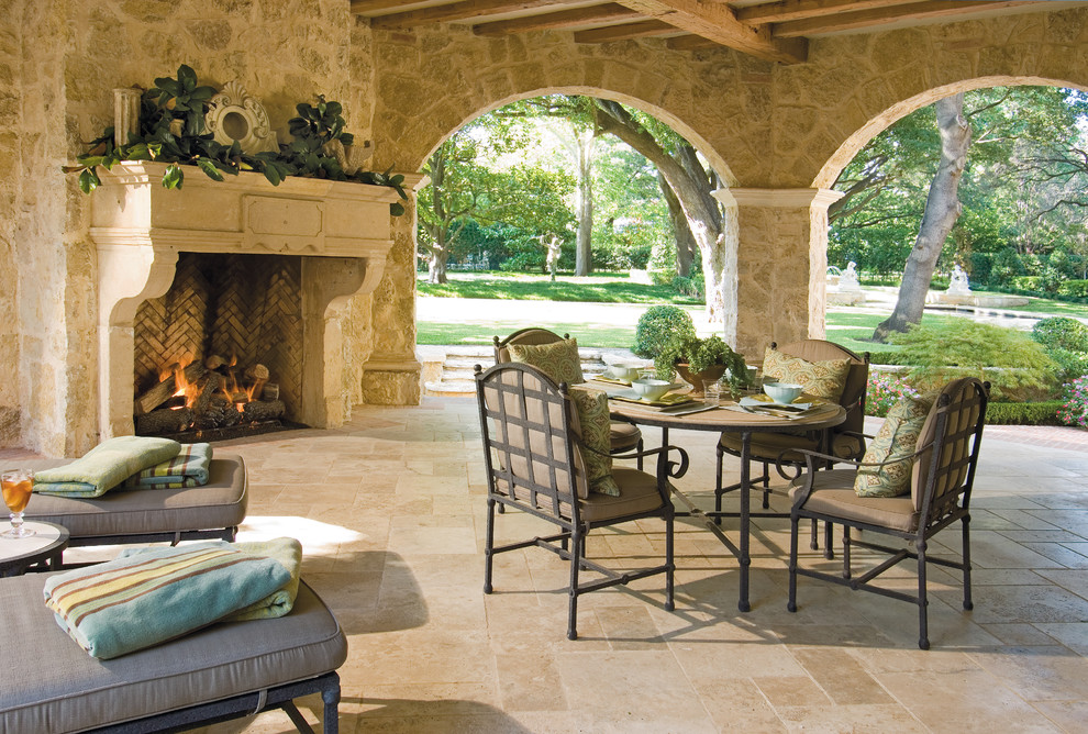 Photo of a traditional patio in Dallas with a fire feature and a roof extension.