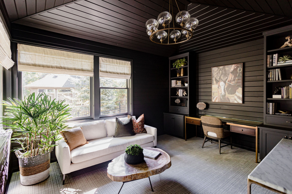 Photo of a small classic study in Minneapolis with black walls, carpet, a built-in desk, multi-coloured floors, a wood ceiling and wood walls.