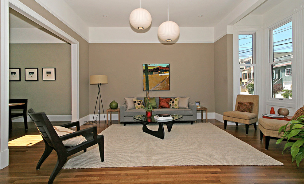 Photo of a large contemporary living room in San Francisco with beige walls.