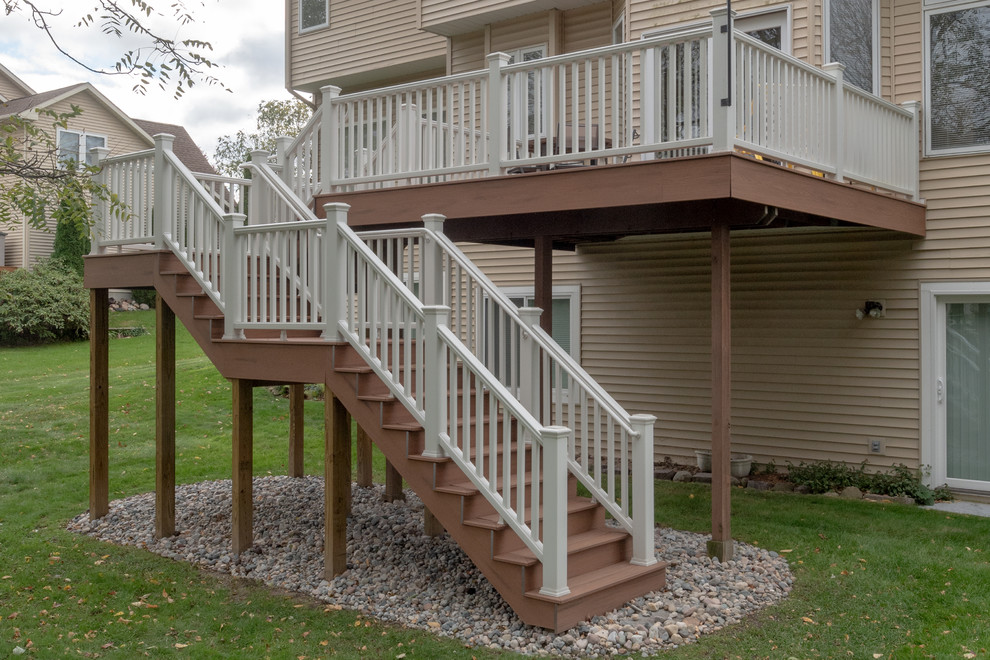 Mid-sized transitional backyard deck photo with no cover