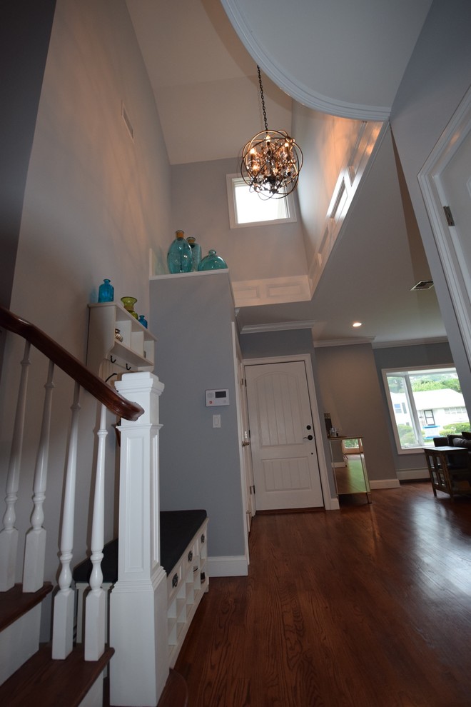 Inspiration for a transitional dark wood floor entryway remodel