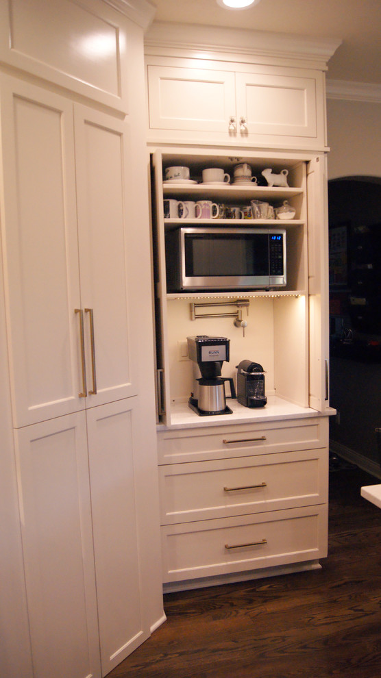 Inspiration for a transitional kitchen remodel with flat-panel cabinets, white cabinets, quartz countertops, gray backsplash and white countertops