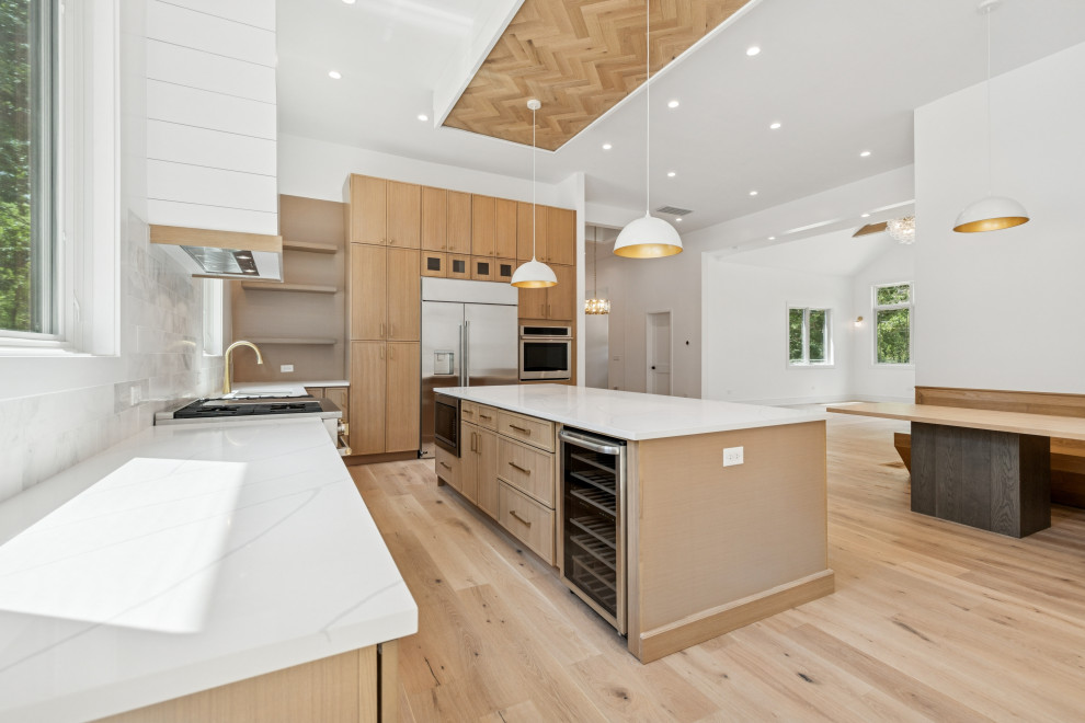 Warm Modern Kitchen with Custom Island and Wood-Inlaid Ceiling