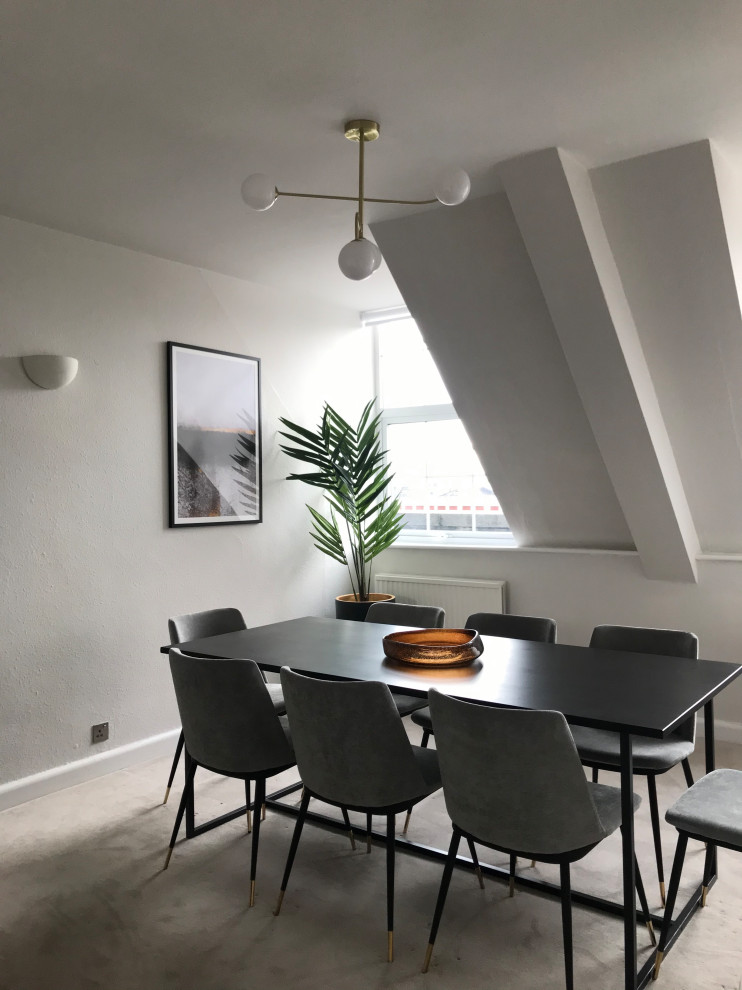 Inspiration for a mid-sized contemporary separate dining room in London with beige walls, carpet, no fireplace, beige floor, wallpaper and wallpaper.