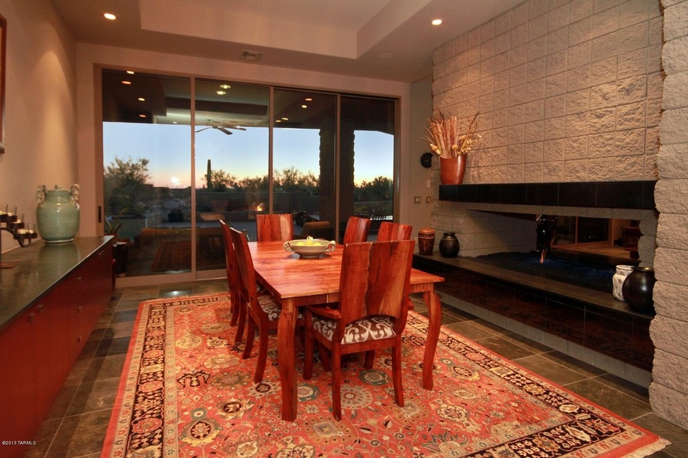 Photo of a large contemporary open plan dining in Phoenix with travertine floors.
