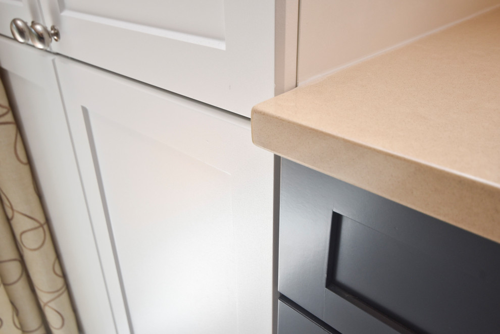 Inspiration for a mid-sized transitional l-shaped vinyl floor and beige floor kitchen remodel in Ottawa with a double-bowl sink, shaker cabinets, white cabinets, quartzite countertops, multicolored backsplash, mosaic tile backsplash, stainless steel appliances, an island and beige countertops