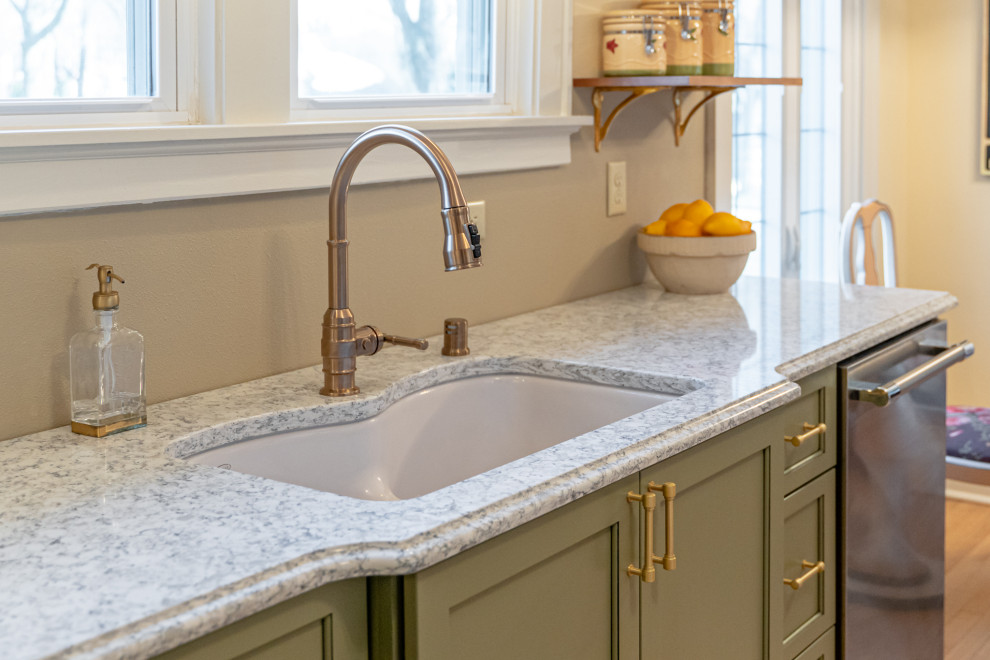 Mid-sized eclectic galley medium tone wood floor and brown floor enclosed kitchen photo in Milwaukee with an undermount sink, shaker cabinets, green cabinets, quartz countertops, multicolored backsplash, stainless steel appliances, no island and multicolored countertops