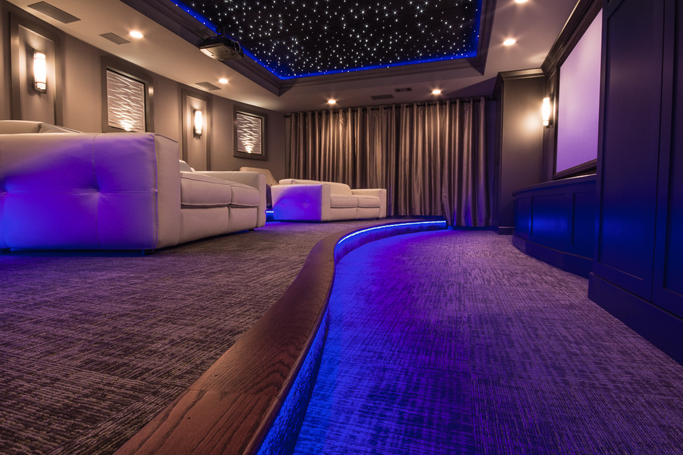 Inspiration for a large contemporary enclosed home theatre in Atlanta with grey walls, carpet, a projector screen and grey floor.