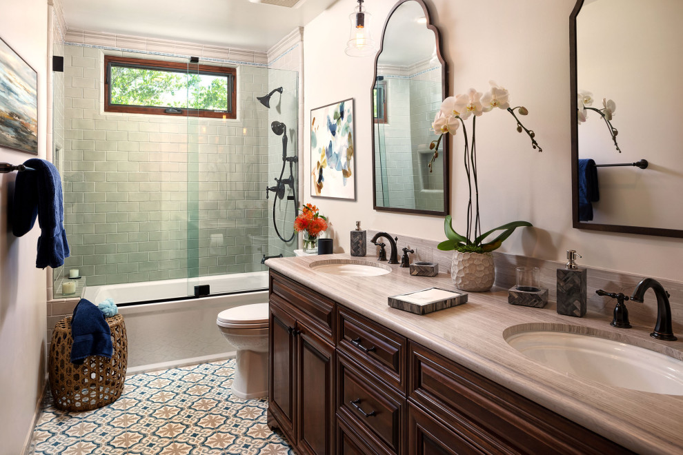 Photo of a medium sized mediterranean ensuite wet room bathroom in Los Angeles with a corner bath, a one-piece toilet, a submerged sink, granite worktops, a sliding door and double sinks.