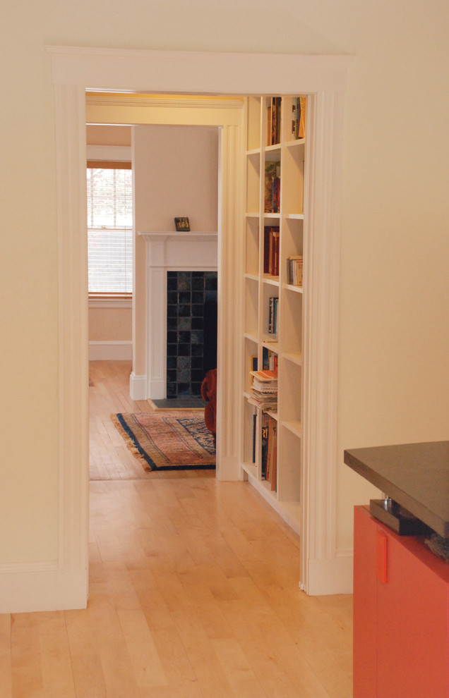 Inspiration for a mid-sized contemporary hallway in Boston with beige walls and light hardwood floors.