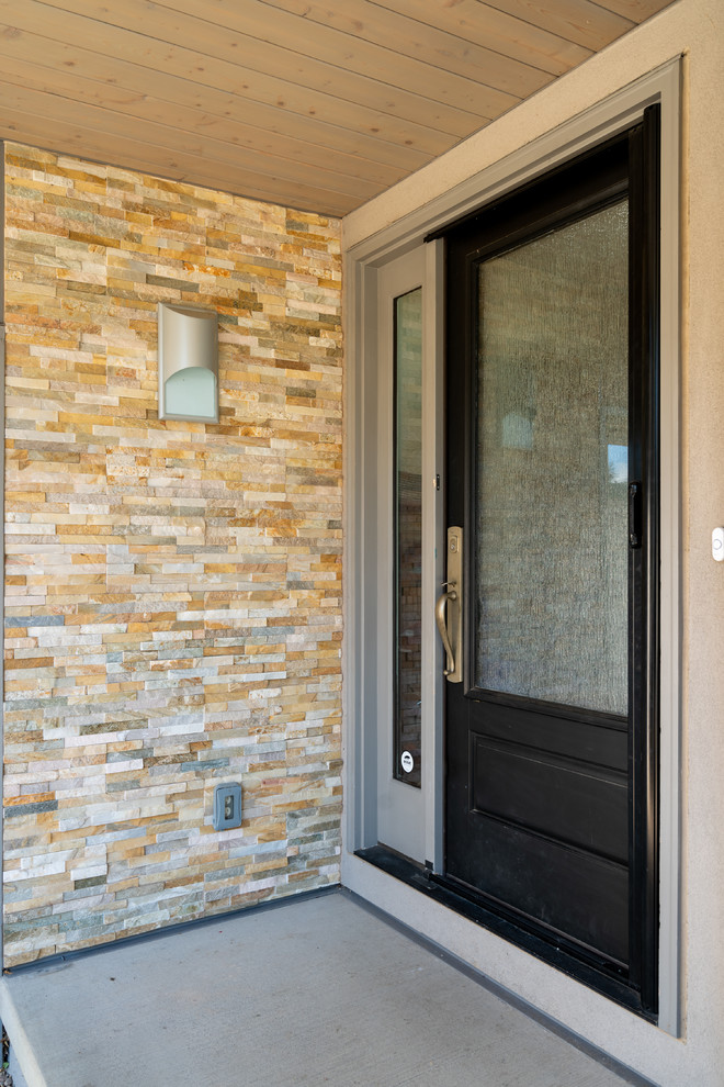 Example of a transitional home design design in Denver