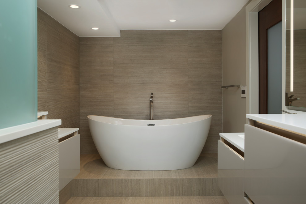 Design ideas for a contemporary 3/4 bathroom in Denver with flat-panel cabinets, grey cabinets, a freestanding tub, a corner shower, a one-piece toilet, gray tile, ceramic tile, grey walls, ceramic floors, a wall-mount sink, granite benchtops, beige floor, a hinged shower door and white benchtops.