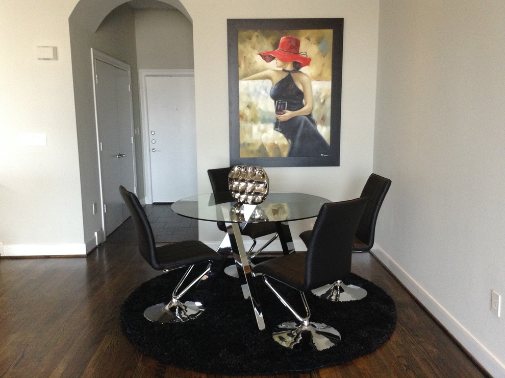 Design ideas for a contemporary dining room in Houston with grey walls and dark hardwood floors.