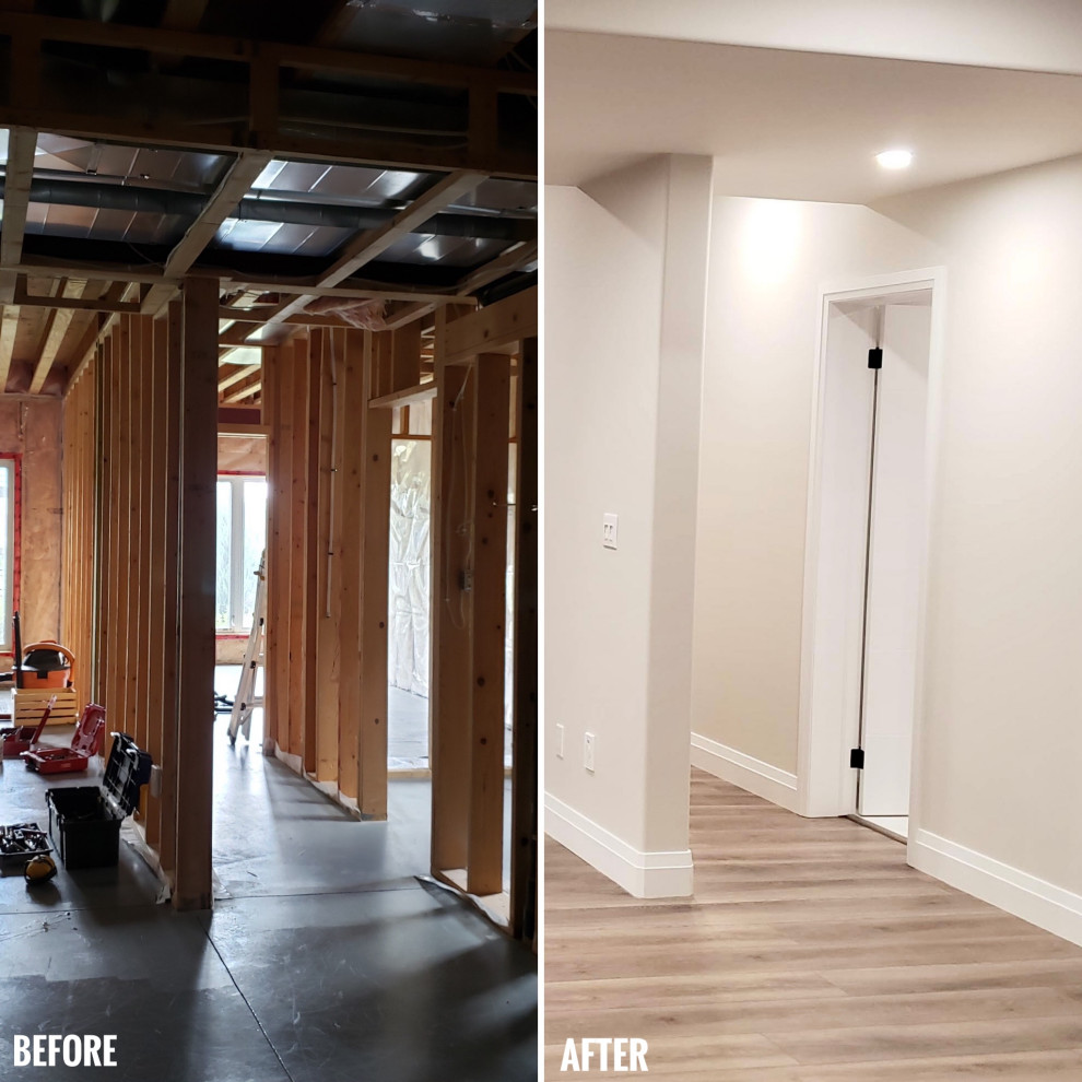 Basement game room - large transitional walk-out vinyl floor and black floor basement game room idea with a standard fireplace and a tile fireplace