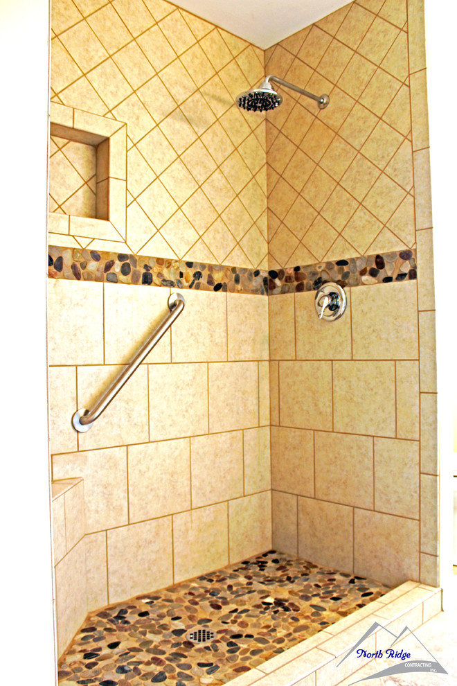 Mid-sized bathroom in Seattle with an alcove shower, beige tile, ceramic tile, beige walls and pebble tile floors.