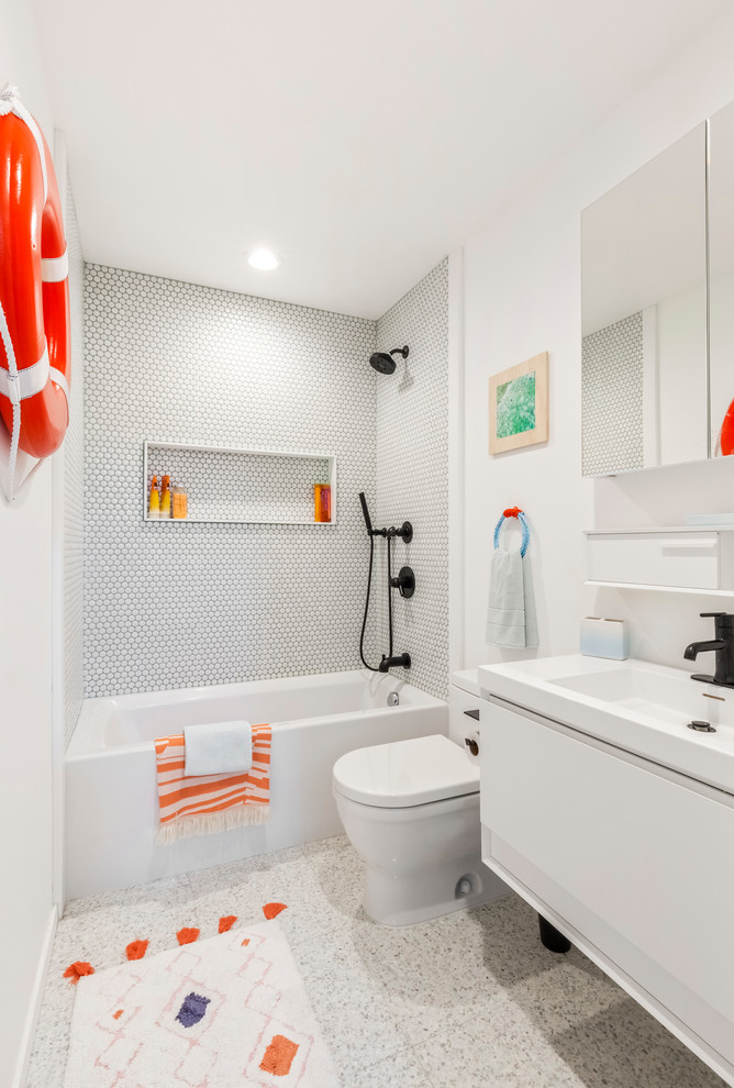 Inspiration for a mid-sized contemporary 3/4 bathroom in New York with flat-panel cabinets, white cabinets, an alcove tub, a shower/bathtub combo, white tile, mosaic tile, white walls, a console sink, grey floor, an open shower, a two-piece toilet, ceramic floors, solid surface benchtops and white benchtops.