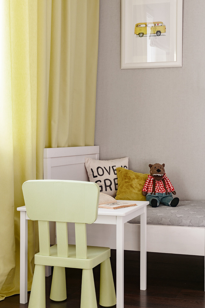 Inspiration for a mid-sized transitional gender-neutral kids' room for kids 4-10 years old in Other with grey walls, laminate floors and brown floor.