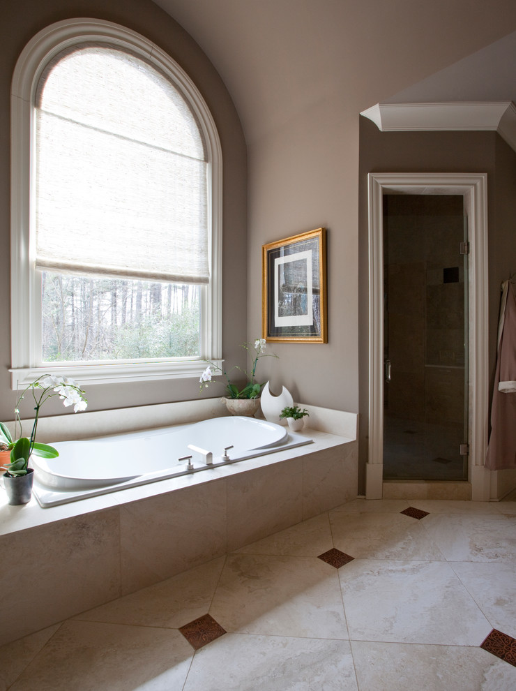 Design ideas for an expansive transitional bathroom in Atlanta with an undermount sink, flat-panel cabinets, medium wood cabinets, an alcove tub, a double shower, a one-piece toilet, brown tile, stone tile, brown walls and travertine floors.