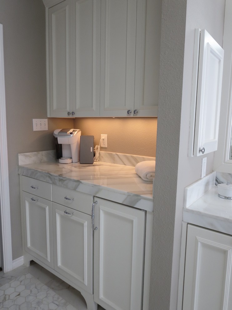 Large transitional master gray tile and porcelain tile porcelain tile corner shower photo in Austin with recessed-panel cabinets, white cabinets, an undermount tub, a two-piece toilet, gray walls, an undermount sink and marble countertops