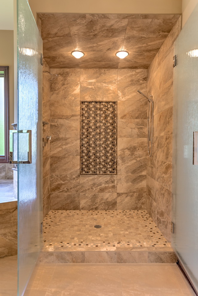 Photo of a large traditional master bathroom in Omaha with a drop-in tub, a corner shower, a two-piece toilet, beige tile, ceramic tile, beige walls, ceramic floors, a drop-in sink, granite benchtops, beige floor and a hinged shower door.