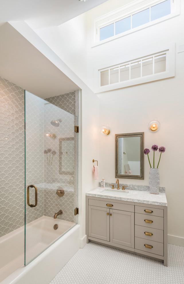 Beach style bathroom in Boston with shaker cabinets, grey cabinets, an alcove tub, a shower/bathtub combo, gray tile, white walls, mosaic tile floors, an undermount sink, white floor, a hinged shower door, grey benchtops, a single vanity, a built-in vanity and vaulted.