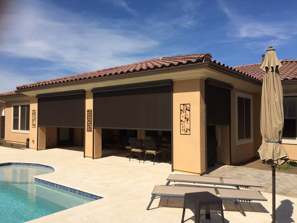 Large transitional backyard pool photo in Phoenix