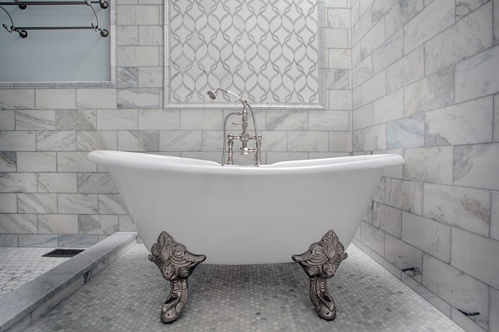 Mid-sized transitional master bathroom in New York with recessed-panel cabinets, grey cabinets, an open shower, a two-piece toilet, white tile, beige walls, an undermount sink, white floor, an open shower, a claw-foot tub, marble and marble floors.