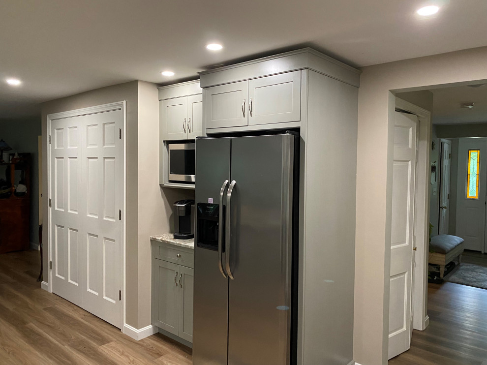 Eat-in kitchen - large transitional u-shaped vinyl floor and brown floor eat-in kitchen idea in Boston with an undermount sink, recessed-panel cabinets, gray cabinets, marble countertops, beige backsplash, porcelain backsplash, stainless steel appliances, a peninsula and multicolored countertops