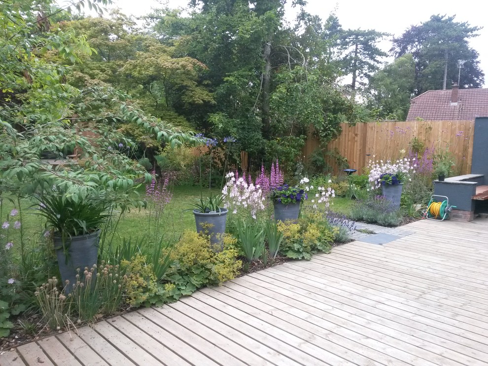 This is an example of a small shabby-chic style garden in Hampshire.