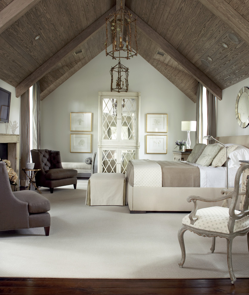 Example of a large classic master dark wood floor and brown floor bedroom design in Houston with white walls, a standard fireplace and a stone fireplace