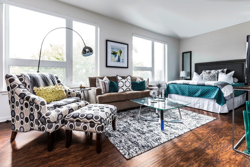 Trendy master dark wood floor and brown floor bedroom photo in Indianapolis with gray walls