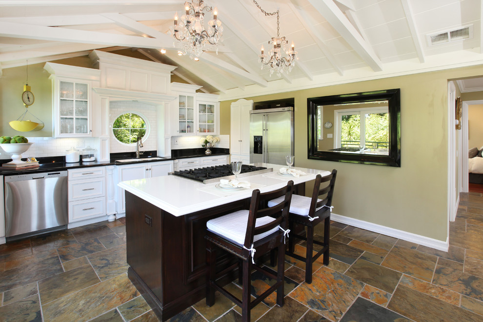 Inspiration for a kitchen in Orange County with stainless steel appliances and slate floors.