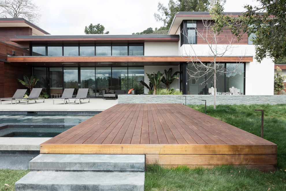 Design ideas for a modern backyard deck in San Francisco with a water feature.