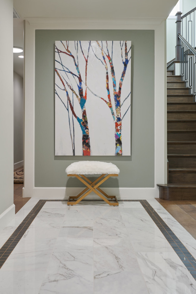 Medium sized contemporary foyer in San Francisco with green walls, porcelain flooring and white floors.