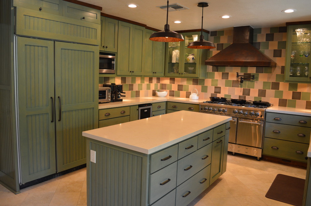 This is an example of a mid-sized eclectic u-shaped eat-in kitchen in Los Angeles with shaker cabinets, green cabinets, quartz benchtops, multi-coloured splashback, terra-cotta splashback and with island.