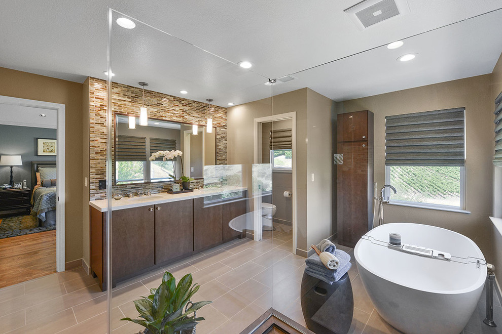 This is an example of a contemporary master bathroom in San Francisco with flat-panel cabinets, dark wood cabinets, a freestanding tub, beige tile, brown tile, multi-coloured tile, yellow tile, matchstick tile, quartzite benchtops, a corner shower, a one-piece toilet, brown walls, porcelain floors and an undermount sink.