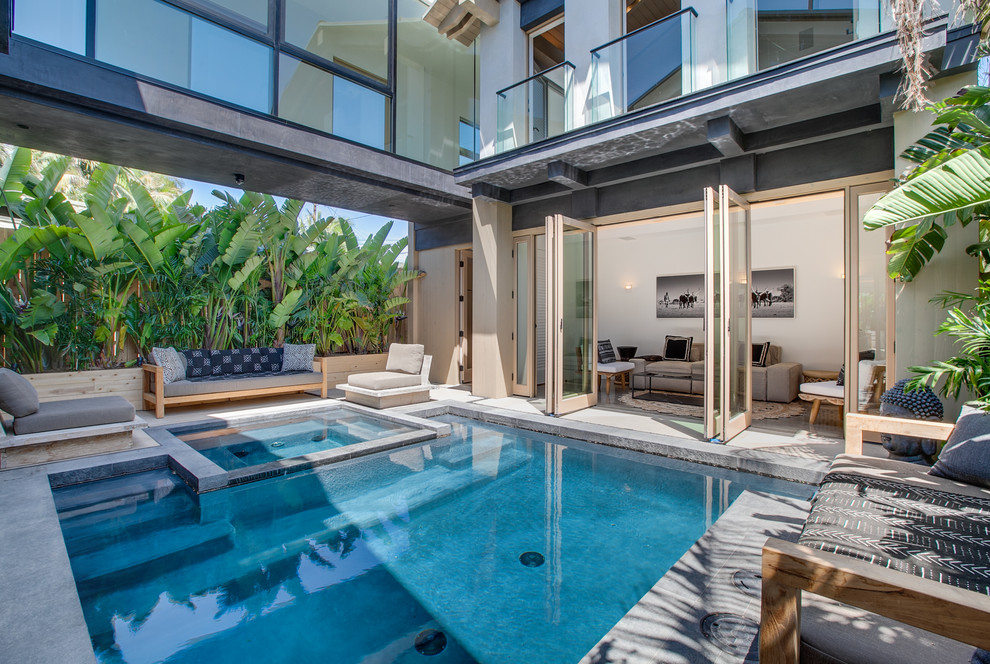 Beach style courtyard rectangular pool in Los Angeles with a hot tub.