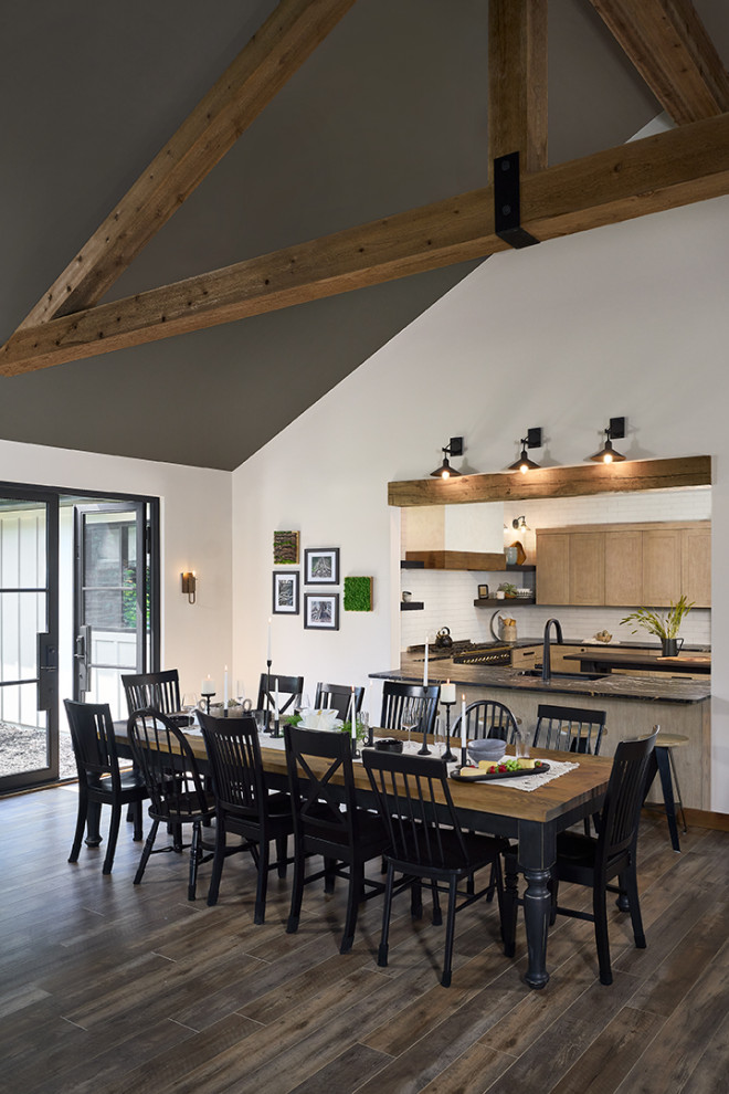 Inspiration for an expansive country dining room in Grand Rapids with exposed beam.