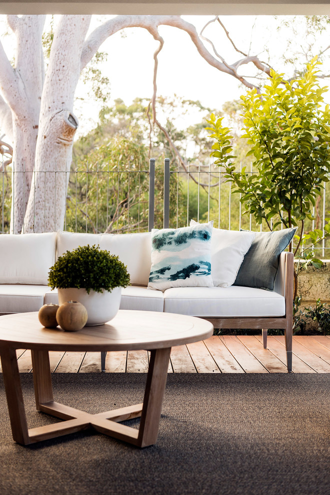 Design ideas for a contemporary backyard deck in Perth with a roof extension.