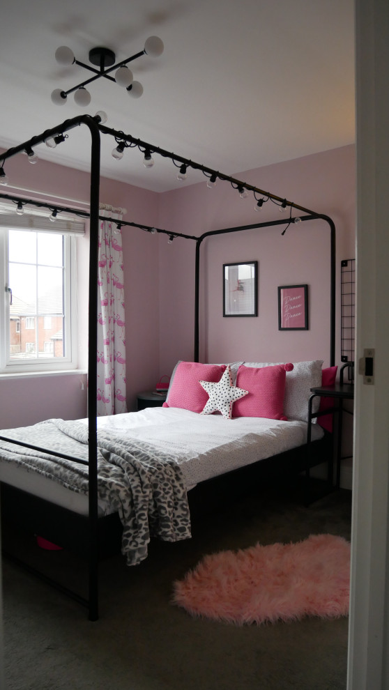 This is an example of a medium sized contemporary grey and pink bedroom in West Midlands with pink walls, carpet and grey floors.