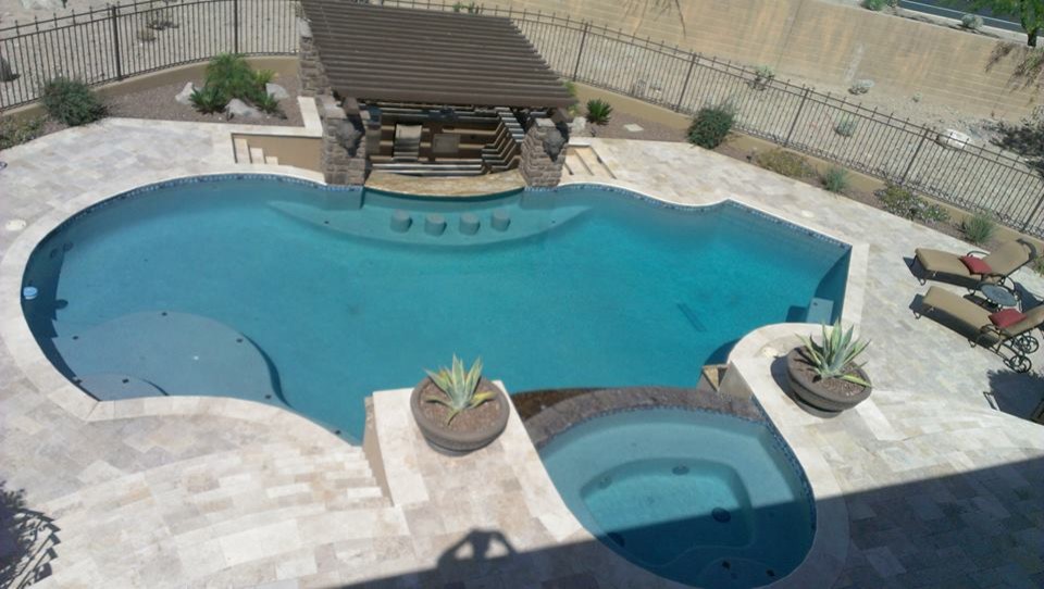 Inspiration for a backyard custom-shaped hot tub remodel in Phoenix