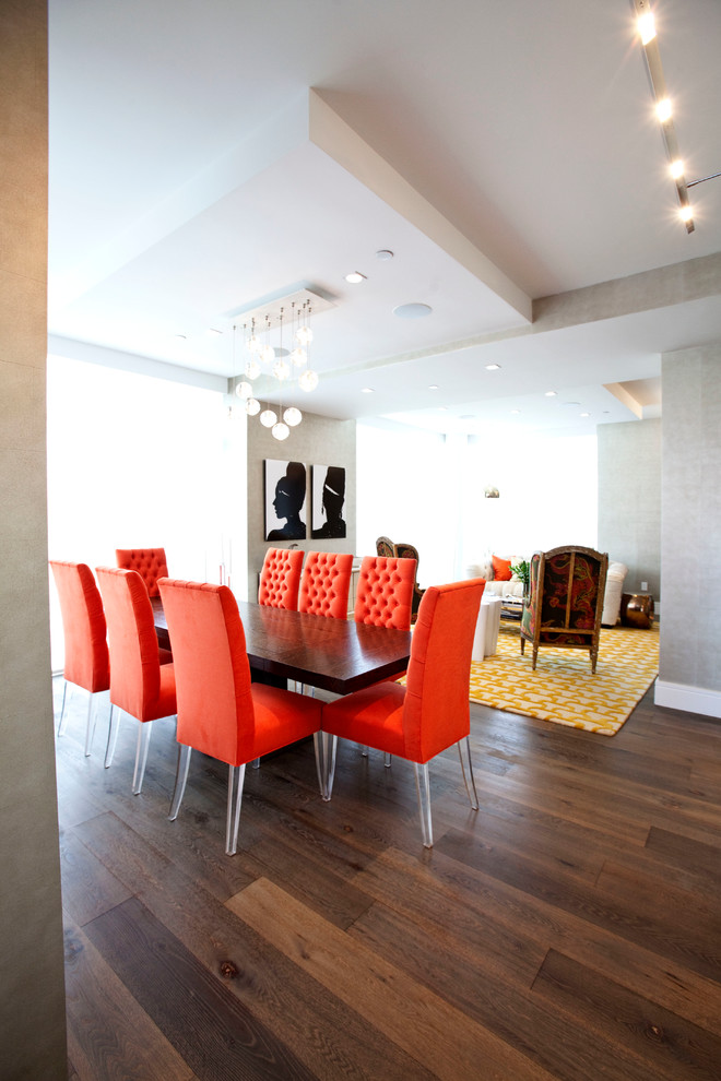 Photo of a contemporary dining room in New York with grey walls and dark hardwood floors.