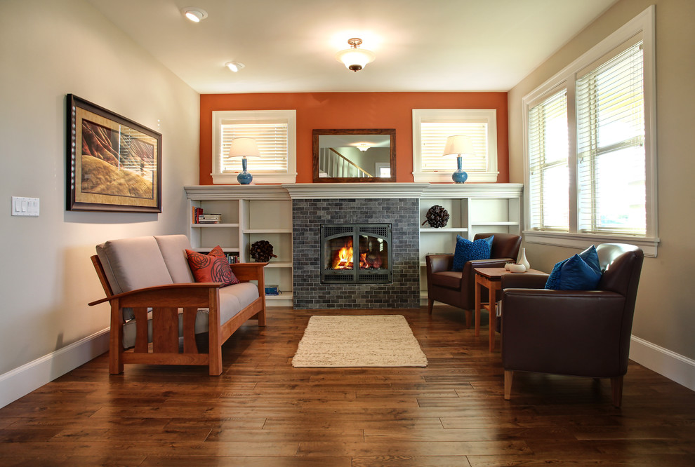 Photo of an arts and crafts living room in Portland with a tile fireplace surround.