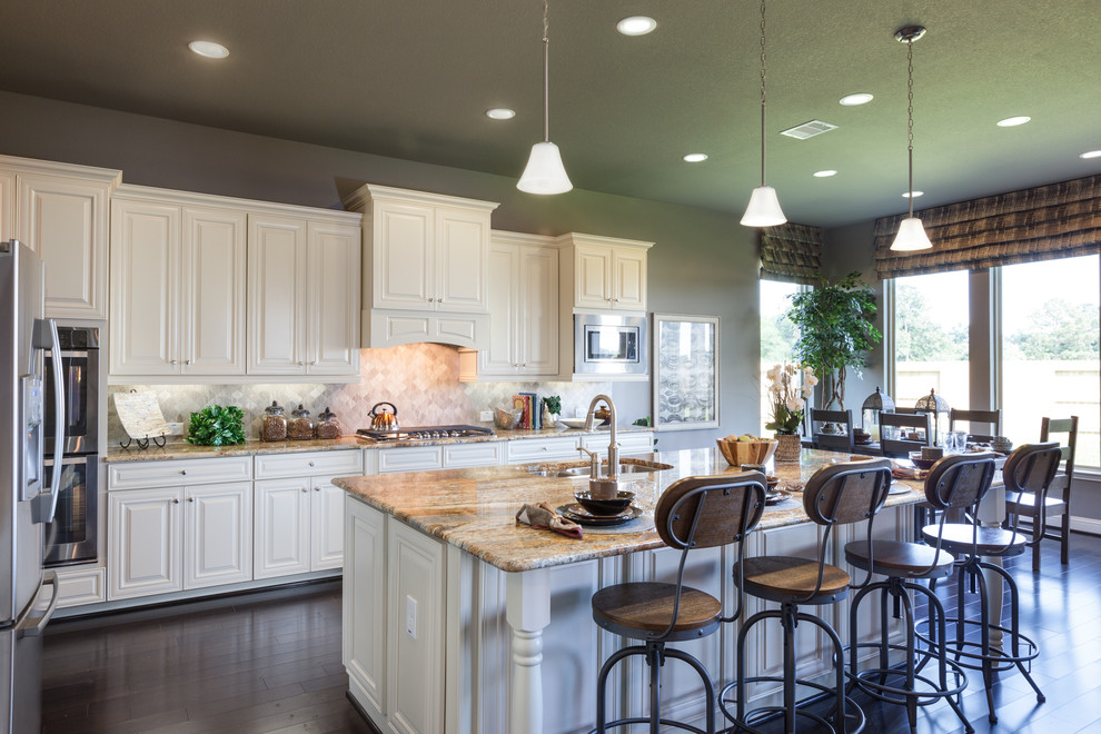 Photo of a country eat-in kitchen in Houston with white cabinets, beige splashback, stainless steel appliances, dark hardwood floors and with island.