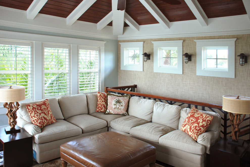 Design ideas for a traditional family room in Tampa with beige walls.