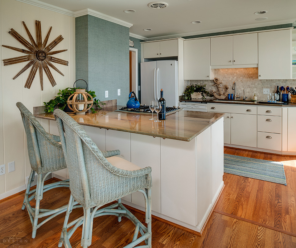 Eclectic galley vinyl floor eat-in kitchen photo with a drop-in sink, flat-panel cabinets, white cabinets, granite countertops, white backsplash, stone tile backsplash, stainless steel appliances and a peninsula